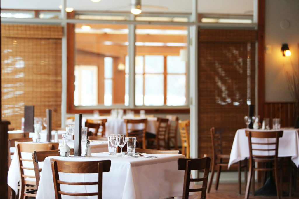 A white tablecloth on a table in a restaurant.